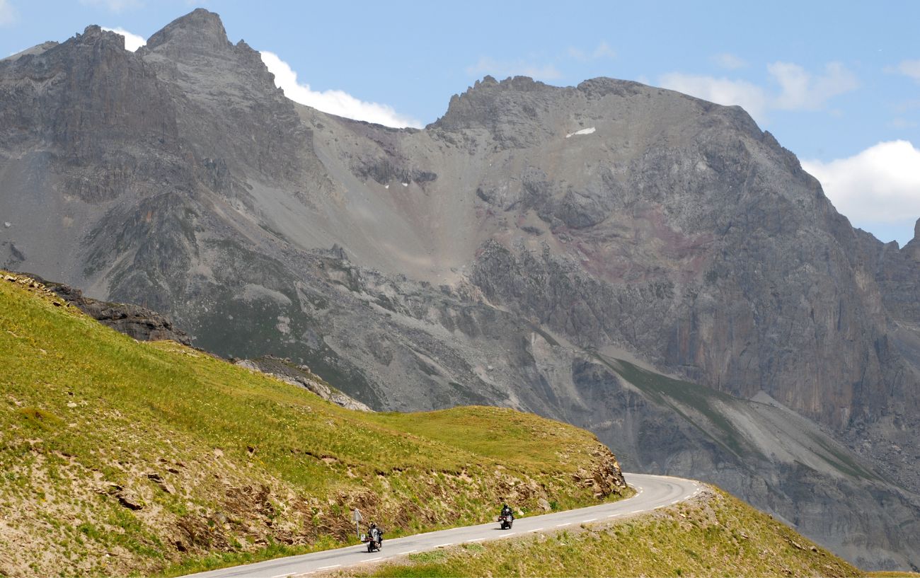 Two motorcycles ride up the Col du Galibier.