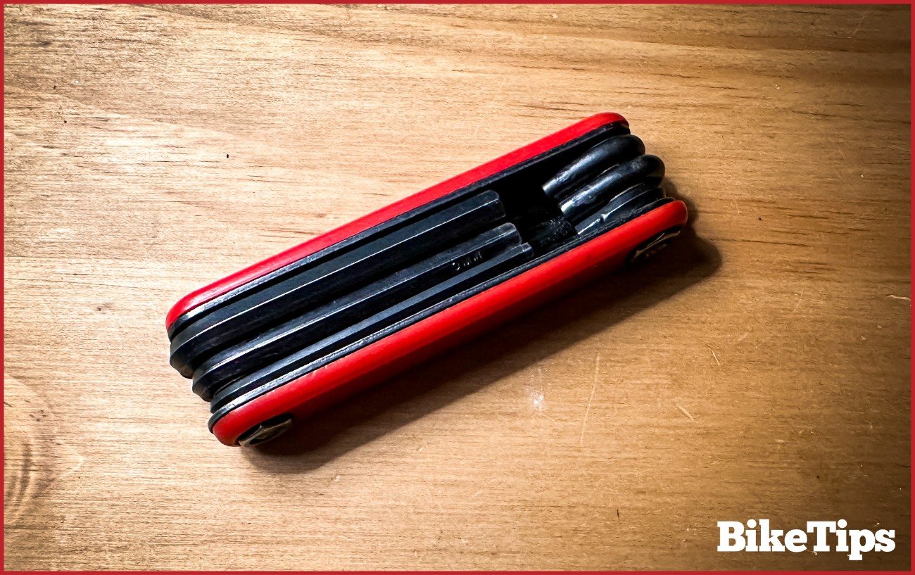 An Allen key set against a wooden background.