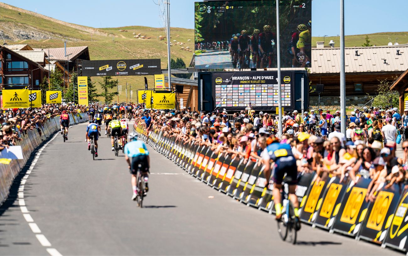 Cyclists approaching the finish line of the 2022 L'Etape du Tour.