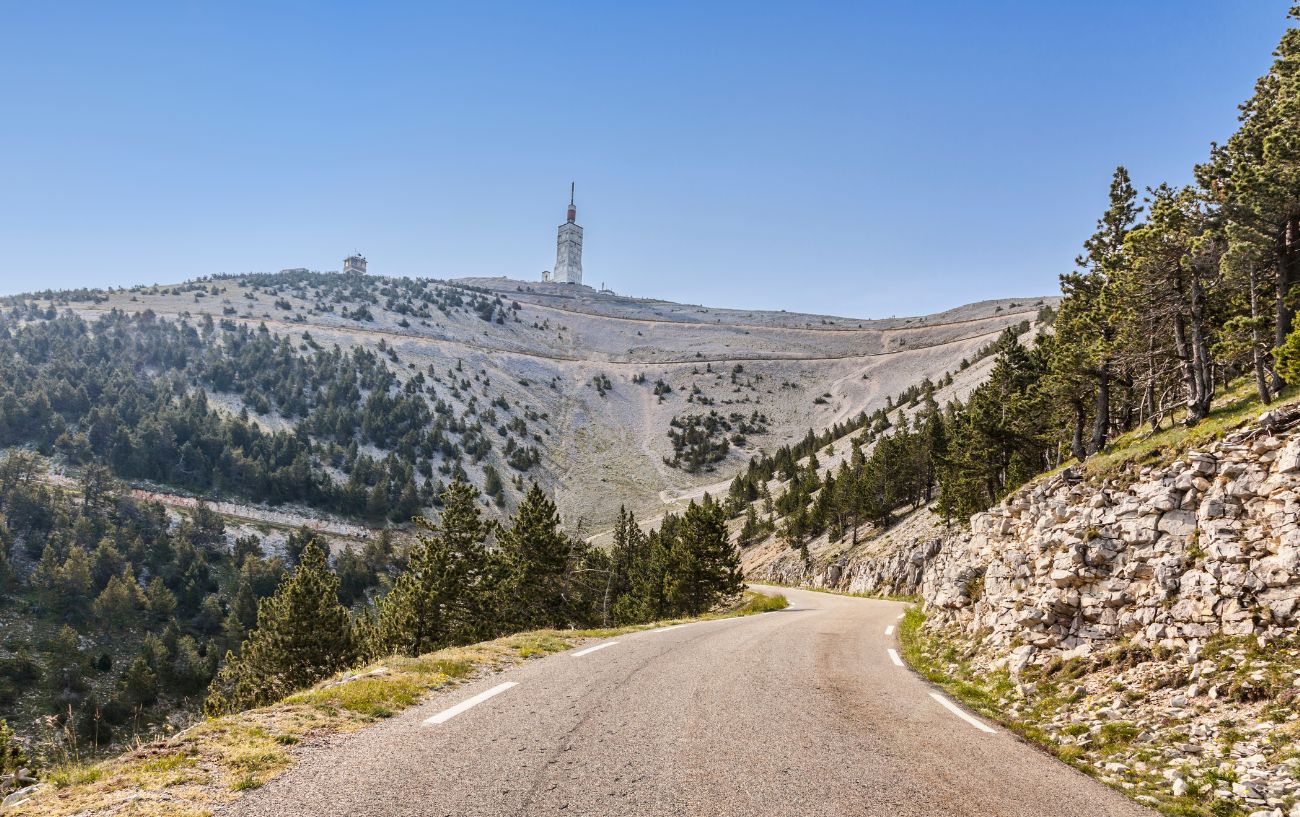 A road snakes through a granite gorge on the road to Mont Ventoux.