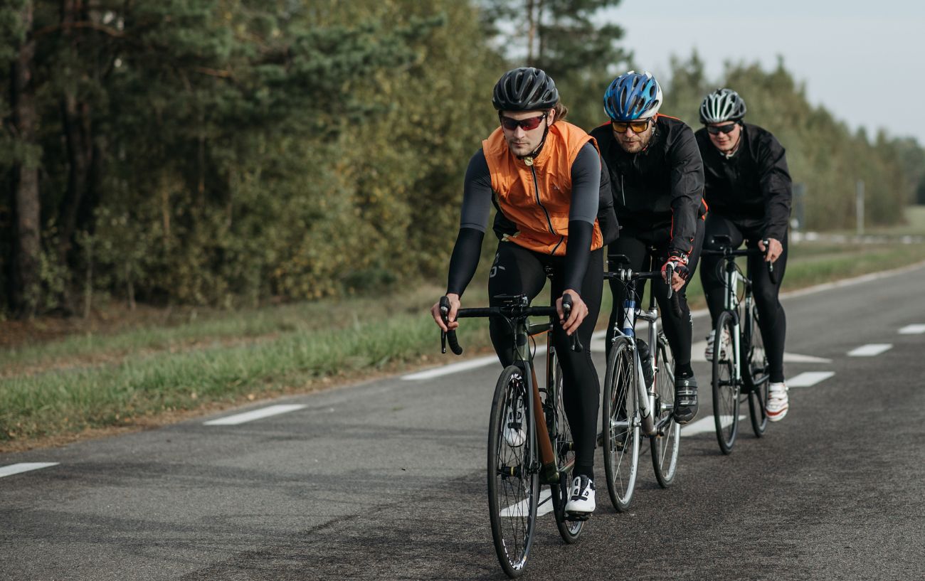 A group of cyclists out on a social ride on country lanes.