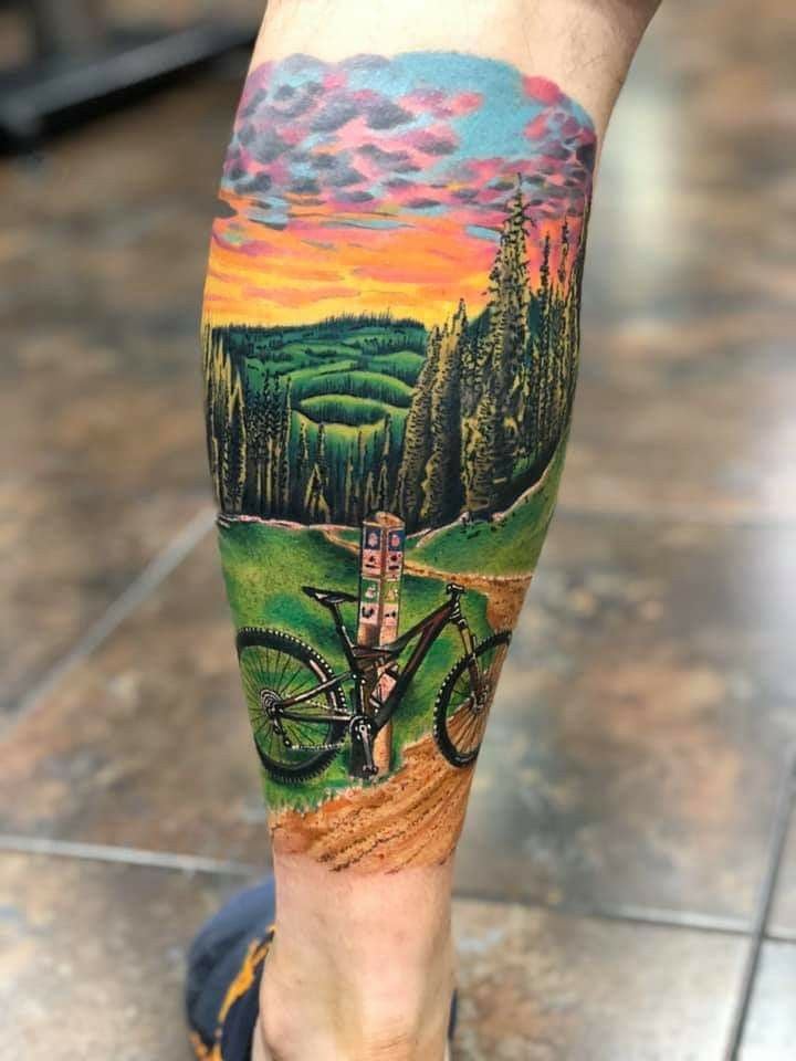 illustrative bicycle tattoo of a bike in mountain landscape