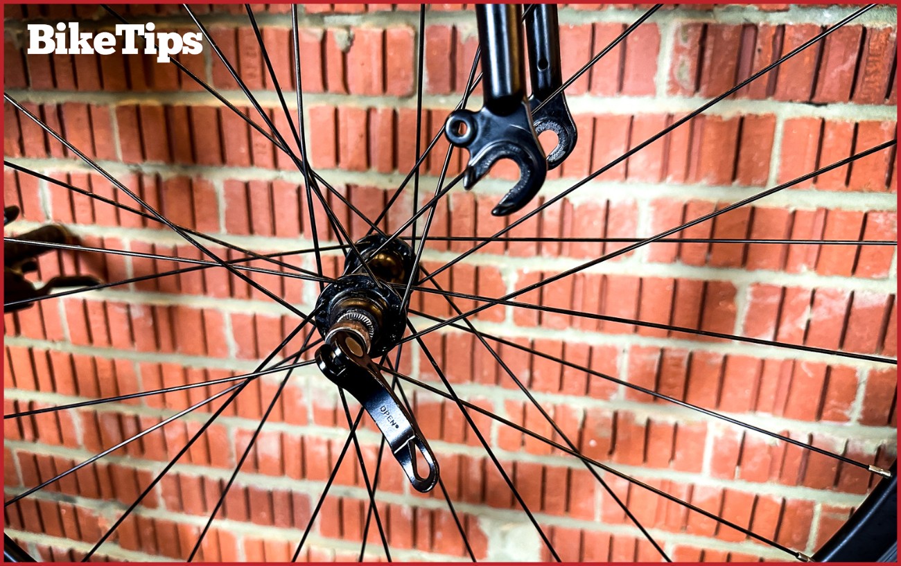 Showing the removal of a road bike wheel from the fork.