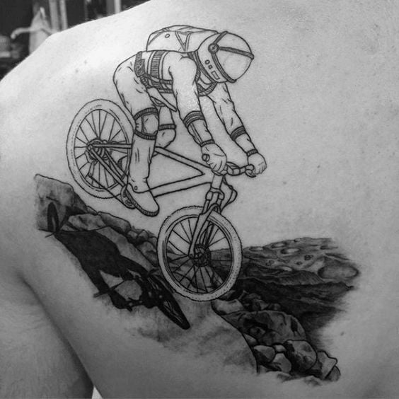 astronaut rider bicycle tattoo in blackwork