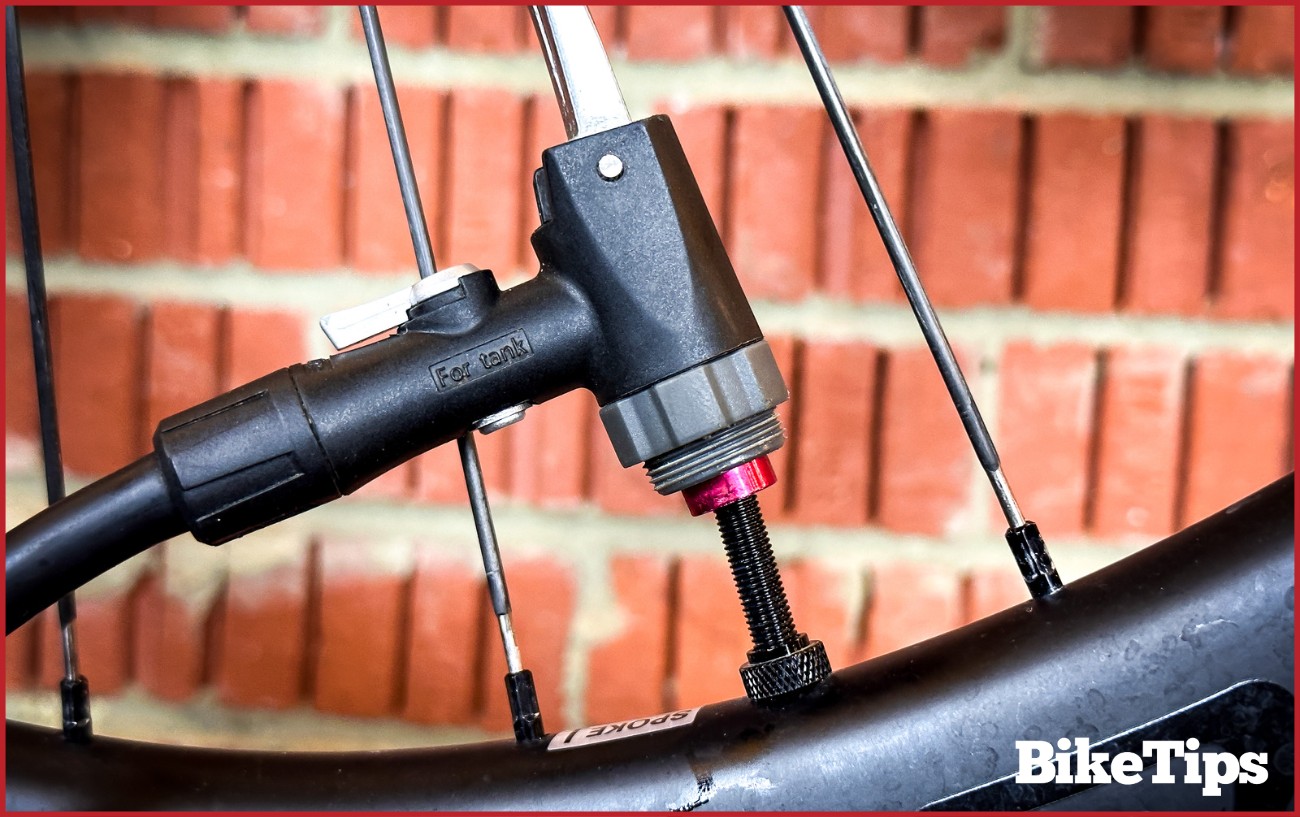 A track pump adapter on a Presta valve.