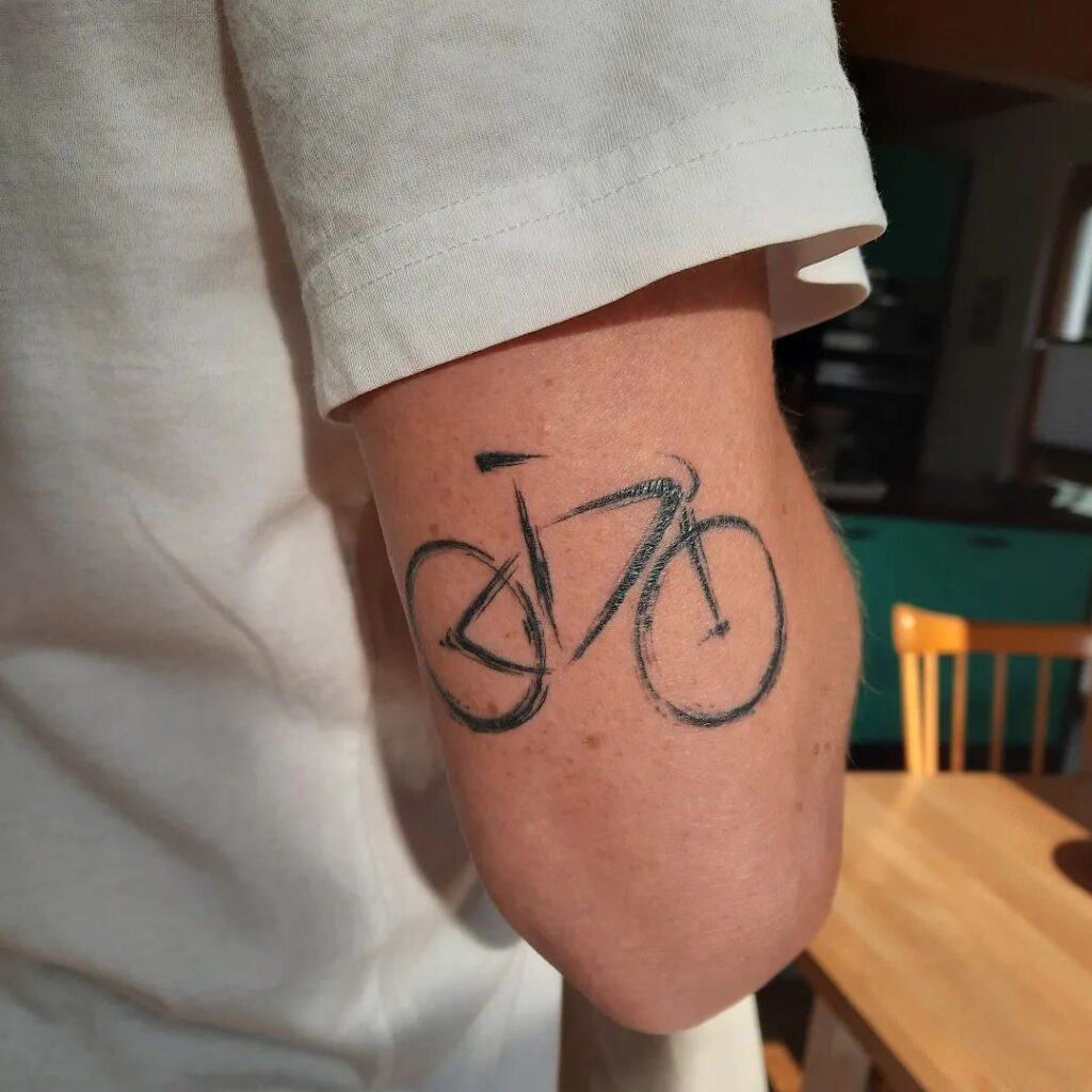 brush stroke bicycle tattoo idea