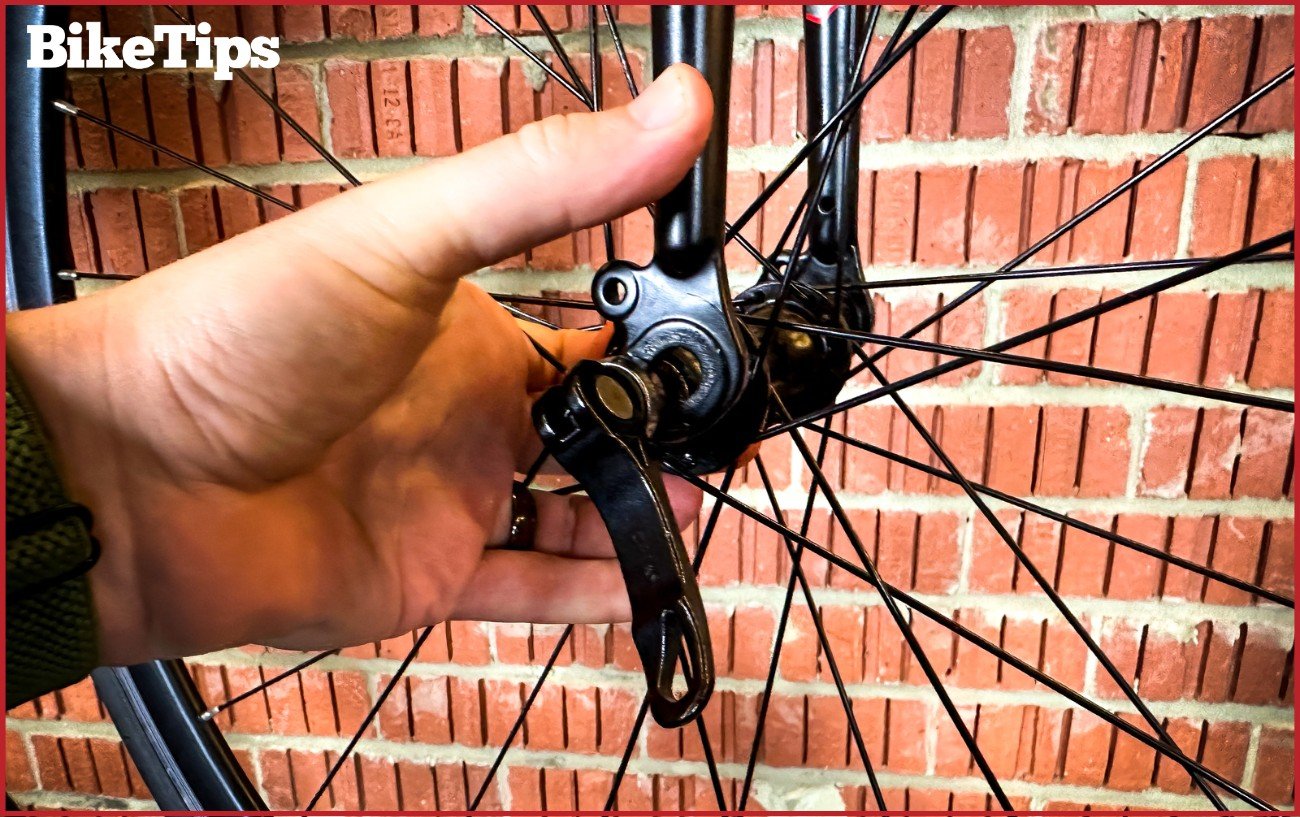 Inserting a 700c road bike wheel into a aluminum fork.