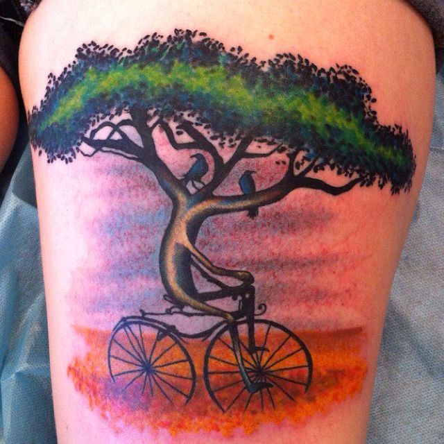 surreal bicycle under the tree tattoo