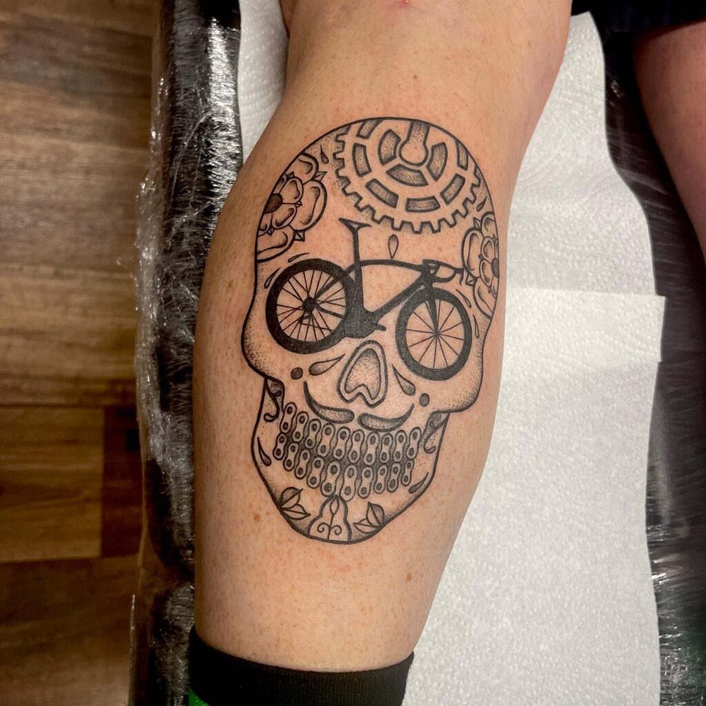 chicano-style sugar skull bicycle tattoo