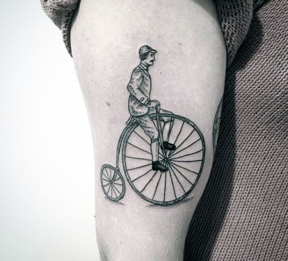 1800s man riding a penny farthing bicycle tattoo