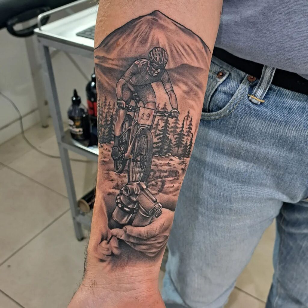 black and gray outdoor cyclist bicycle tattoo