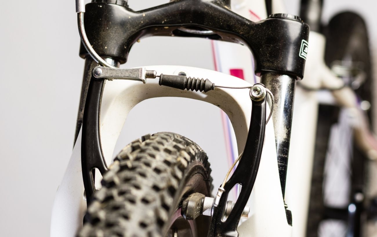 V brakes on a white mountain bike.