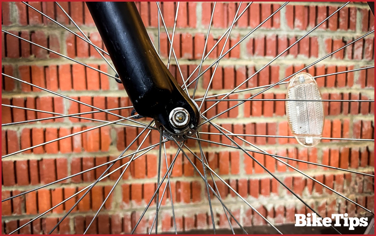 Showing a bolt through axle on a bicycle wheel.