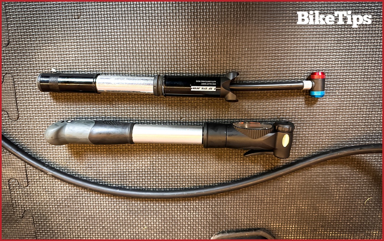 Two hand bicycle pumps next to each other. 