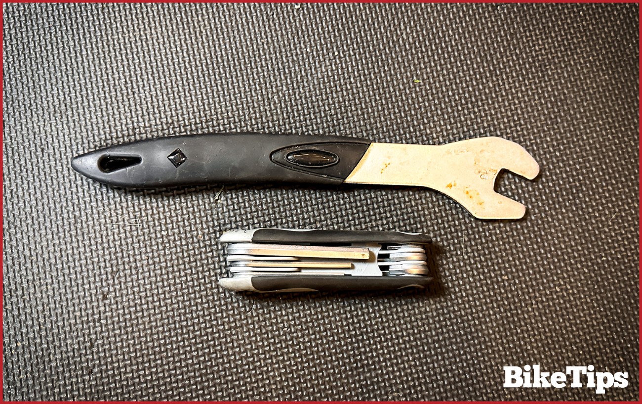 A 15 mm spanner and a set of Allen keys.