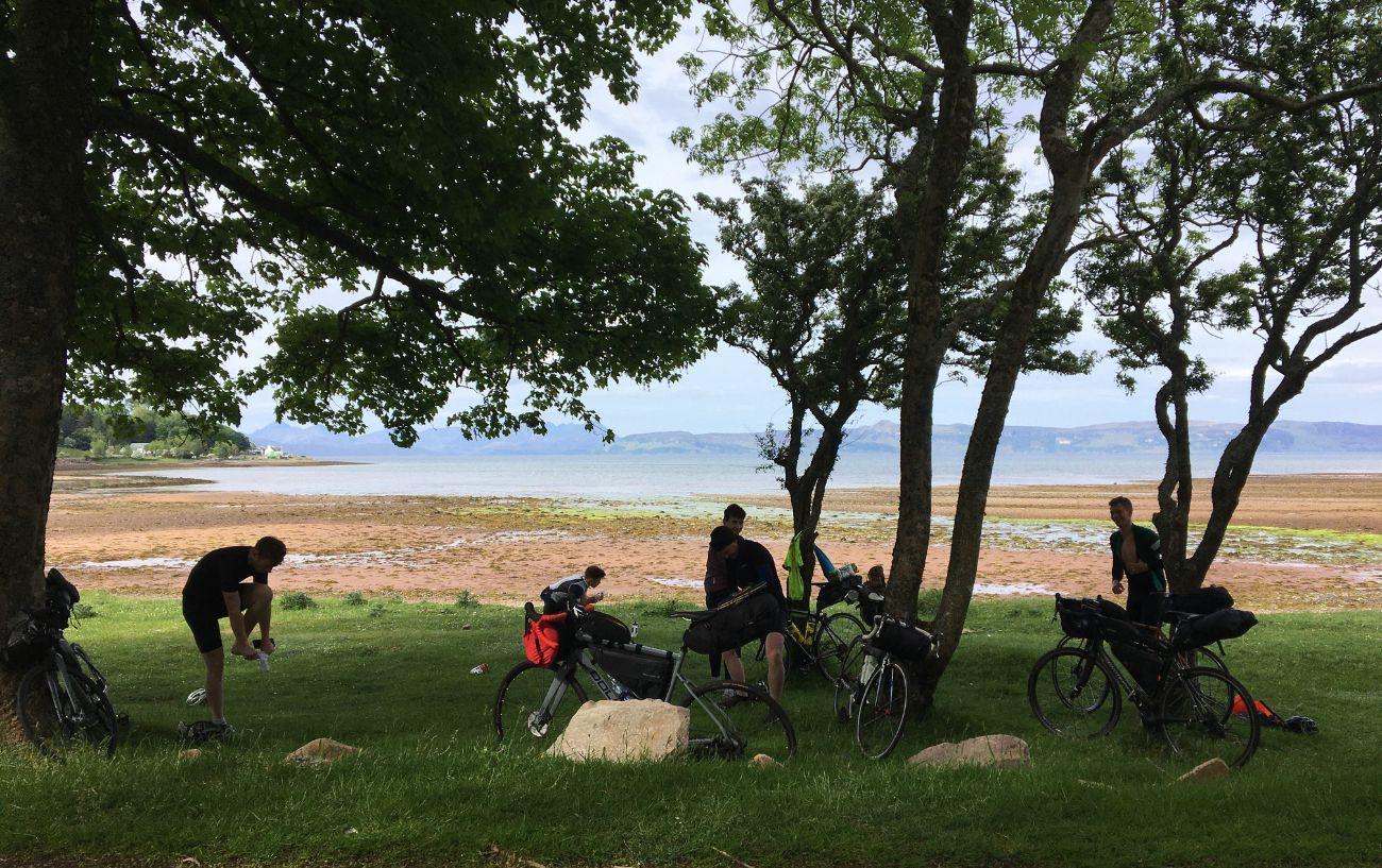 Pausing by a loch while cycling the North Coast 500.
