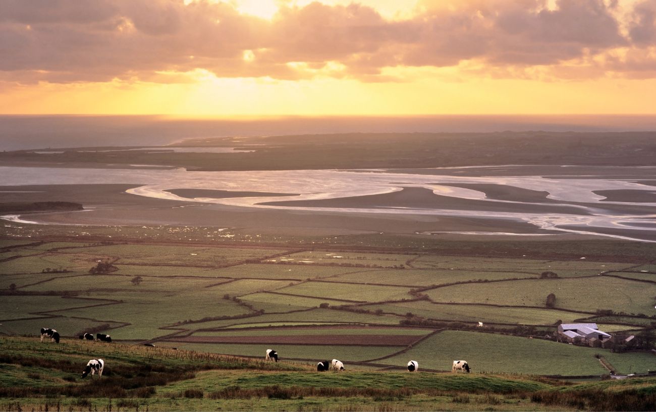 Sunset view across a river plain in northern England.