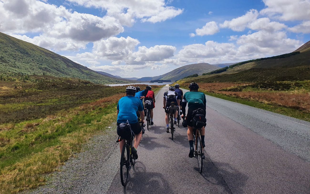 A group of cyclists on the North Coast 500 in Scotland.