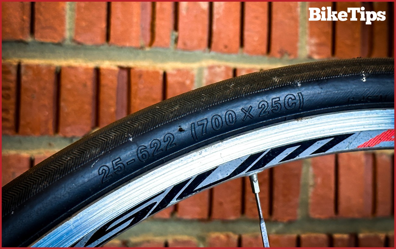 A bike tire showing the sizing code. 