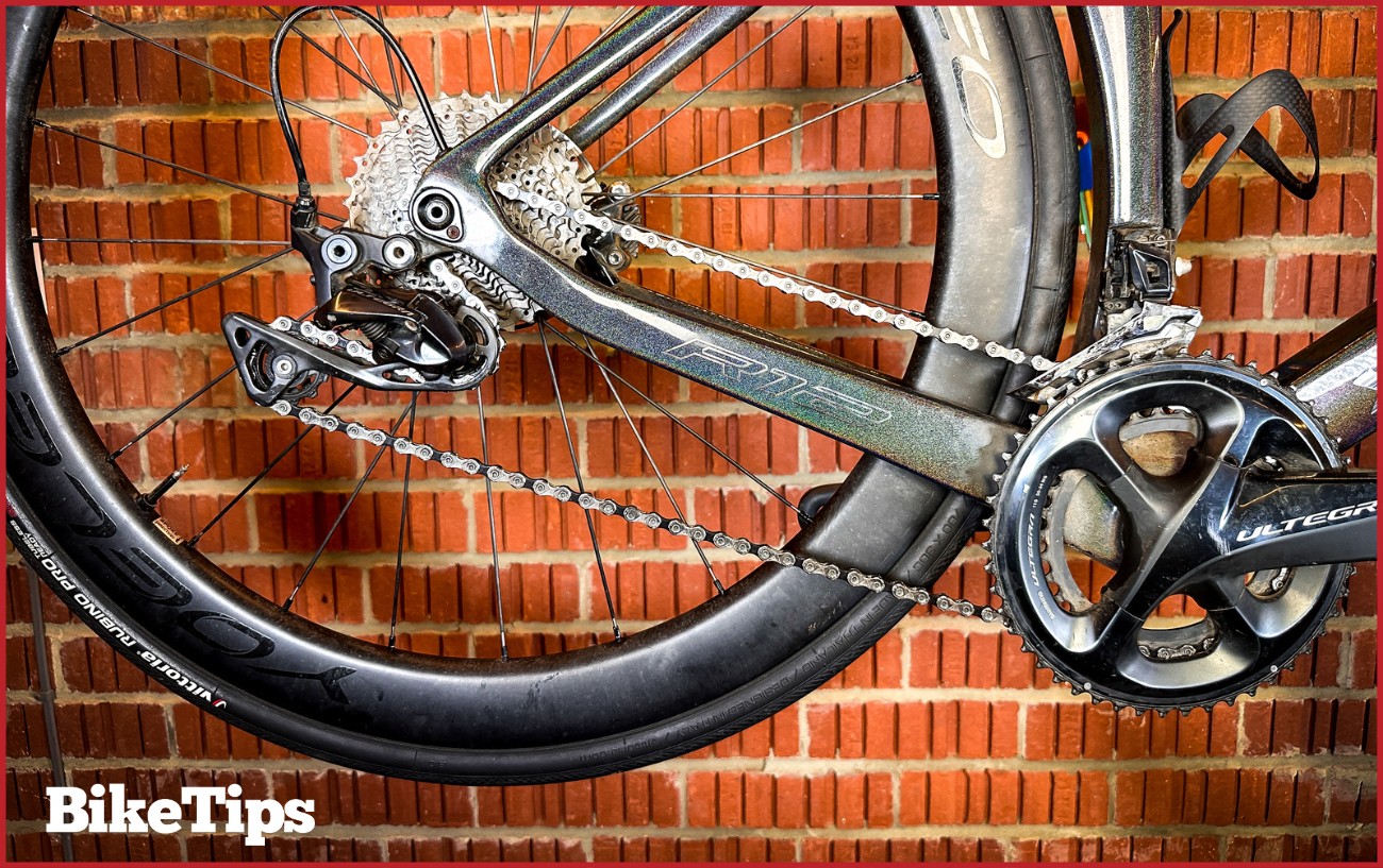 A bike groupset showing with the chain in the smallest cog on the cassette and smallest chainring. 