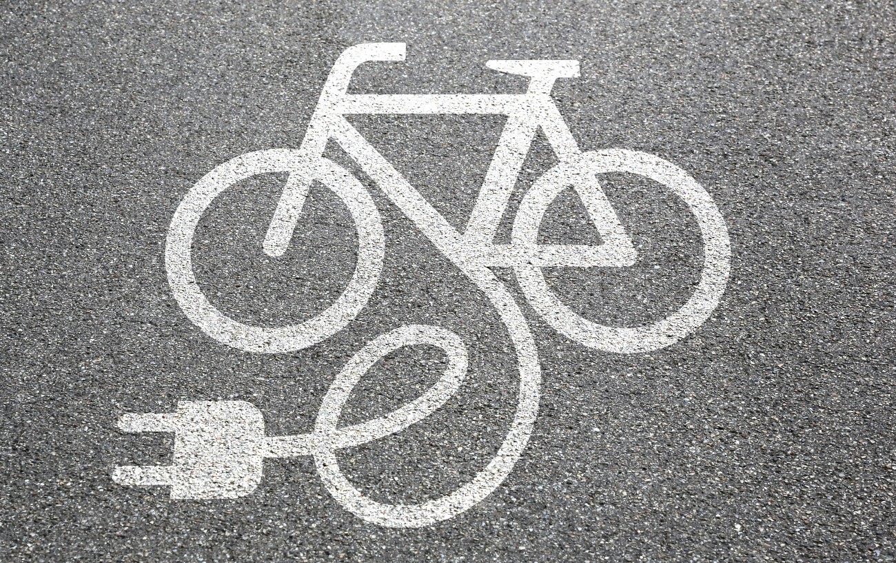 Road painting of signalling an e-bike charging station.