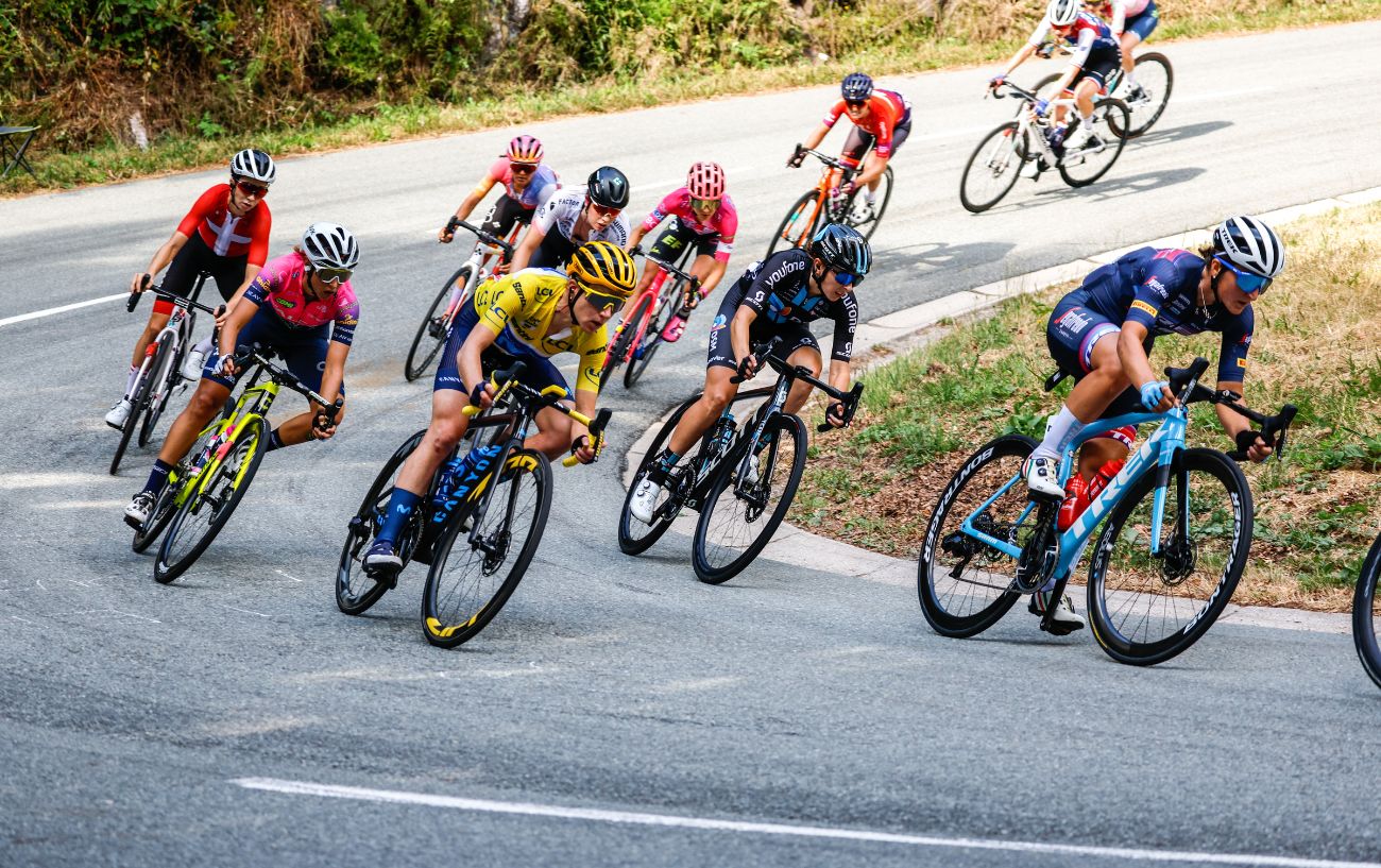 A group of cyclists round a hairpin bend at the Tour de France Femmes.