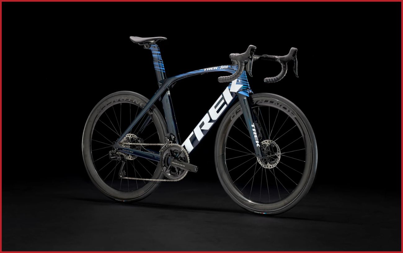 A Trek Madone SLR 9 photographed against a black background.