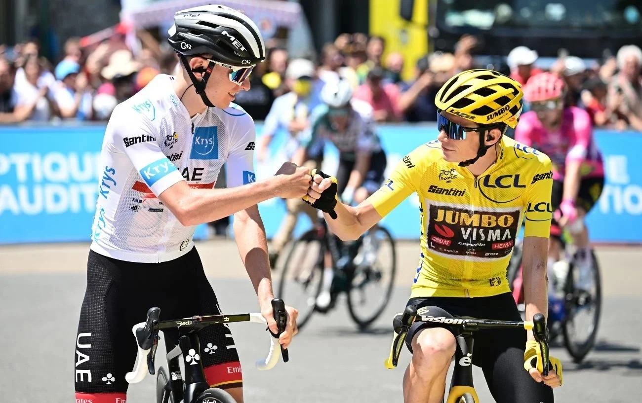 Tadej Pogacar and Jonas Vingegaard bump fists before the start of a Tour de France stage.