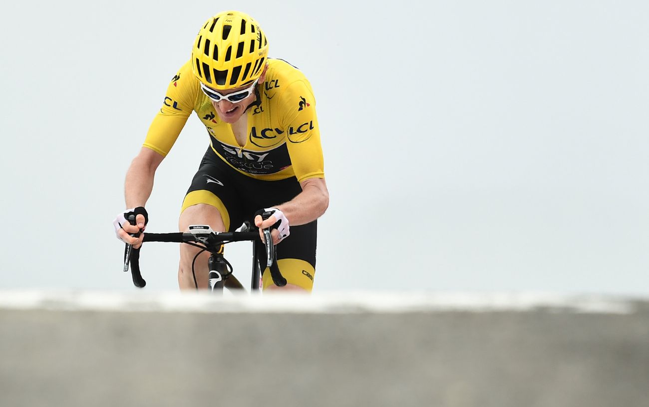 Geraint Thomas riding in the yellow jersey at the 2018 Tour de France.