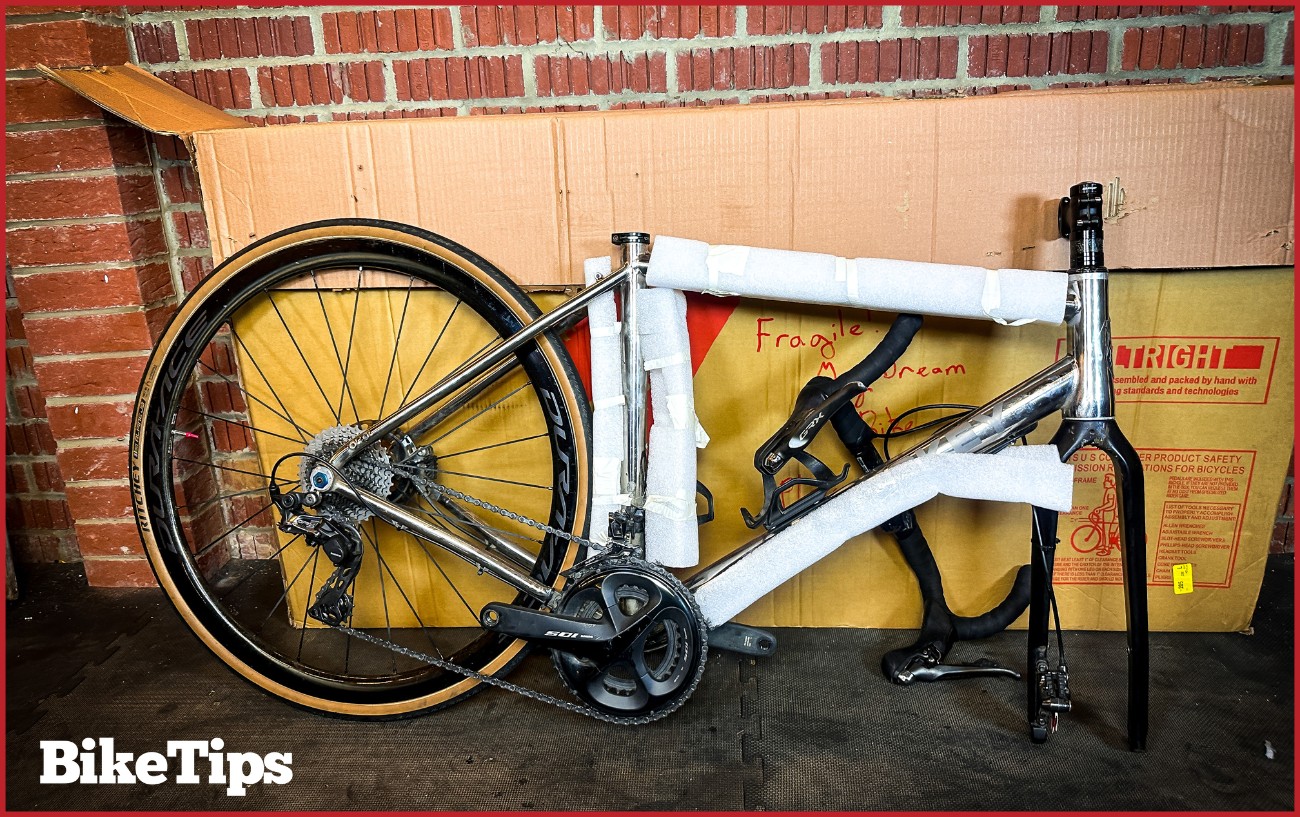 A bike dismantled ready to be packed in a bike box. 