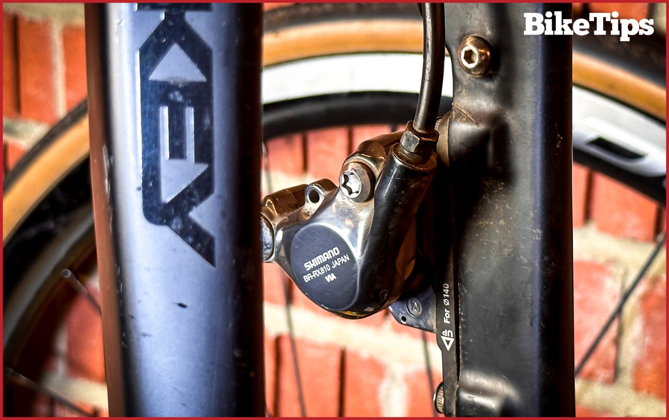 An empty caliper with no brake pads in.