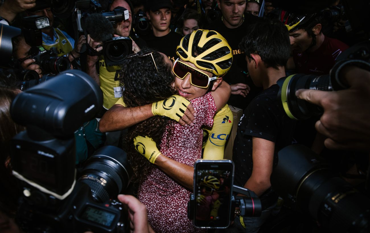 Egan Bernal embraces his wife after winning the 2019 Tour de France.