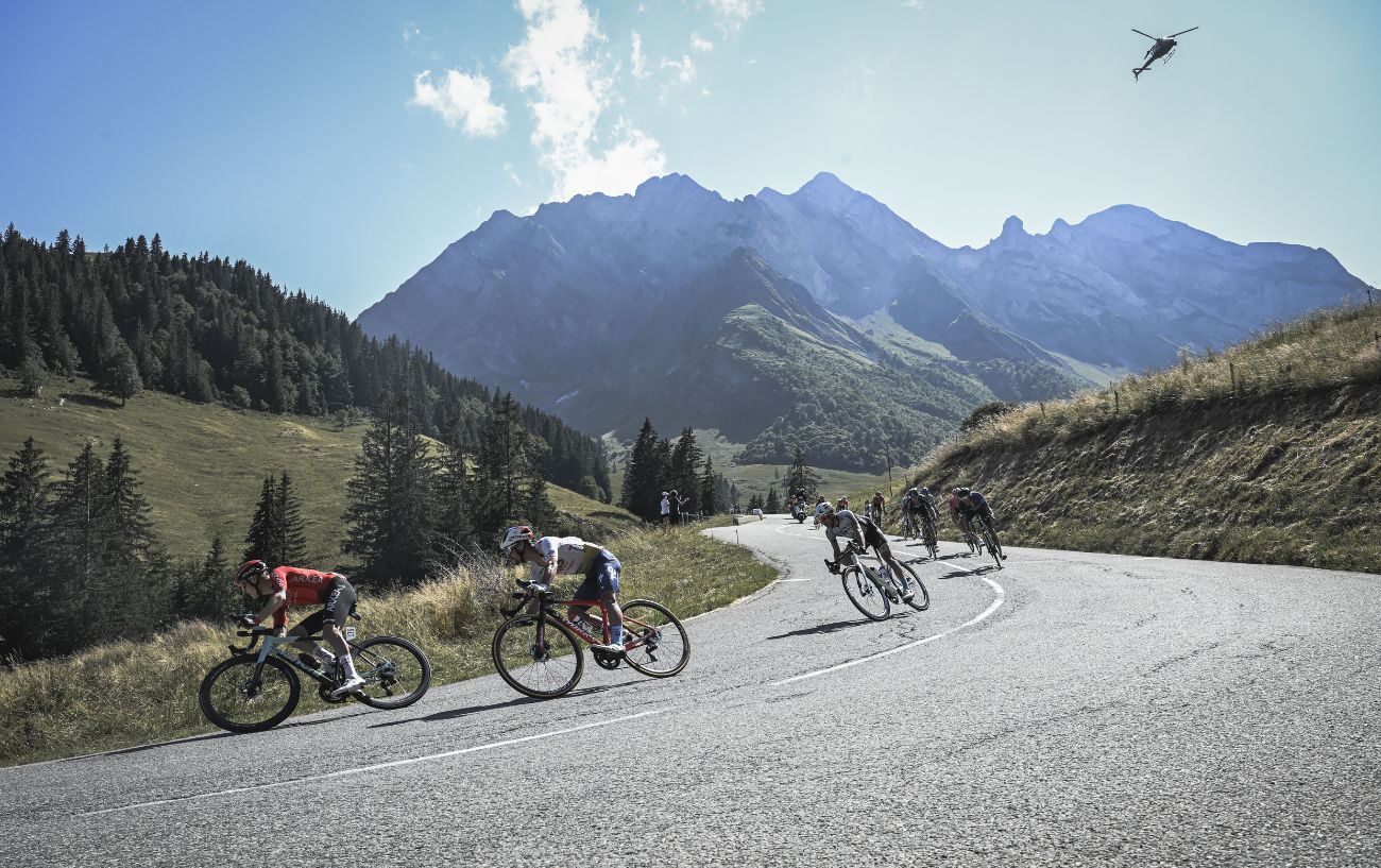 The Tour de France peloton races down a descent on Stage 15.