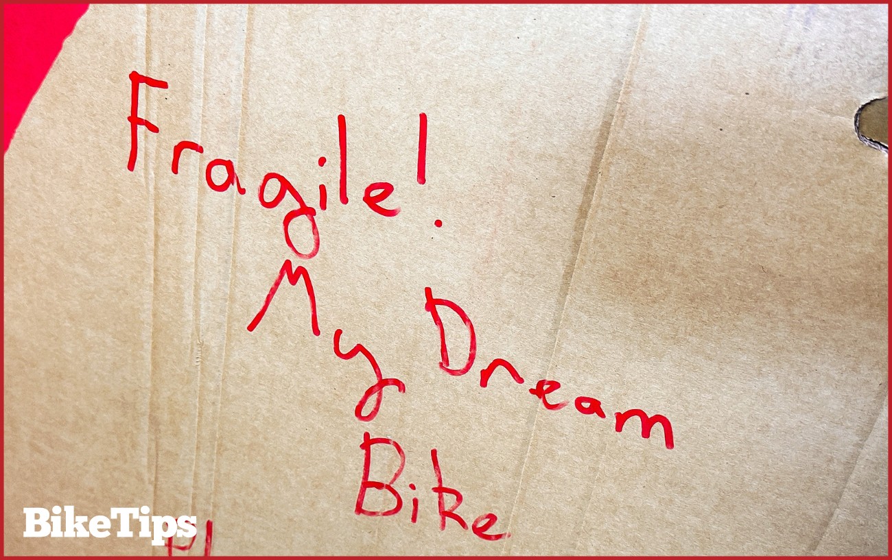 Writing on the side of a bike box.