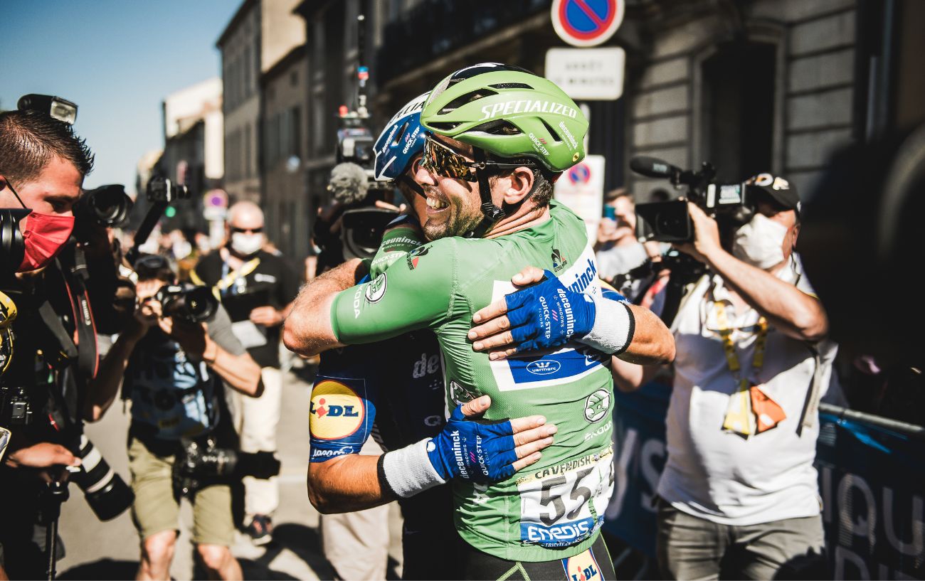 Mark Cavendish embraces his teammate after equalling Eddy Merckx' record of 34 Tour de France stage wins.