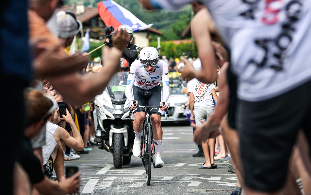 Tadej Pogacar climbs on his road bike after switching from a time trial bike on Stage 16 of the 2023 Tour de France.