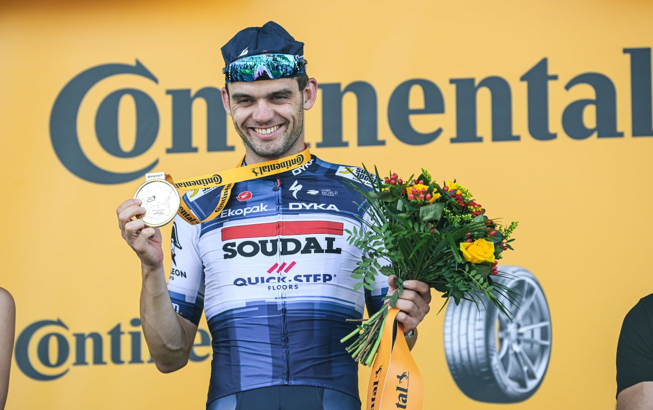 Kasper Asgreen celebrates on the podium after winning Stage 18 of the 2023 Tour de France.