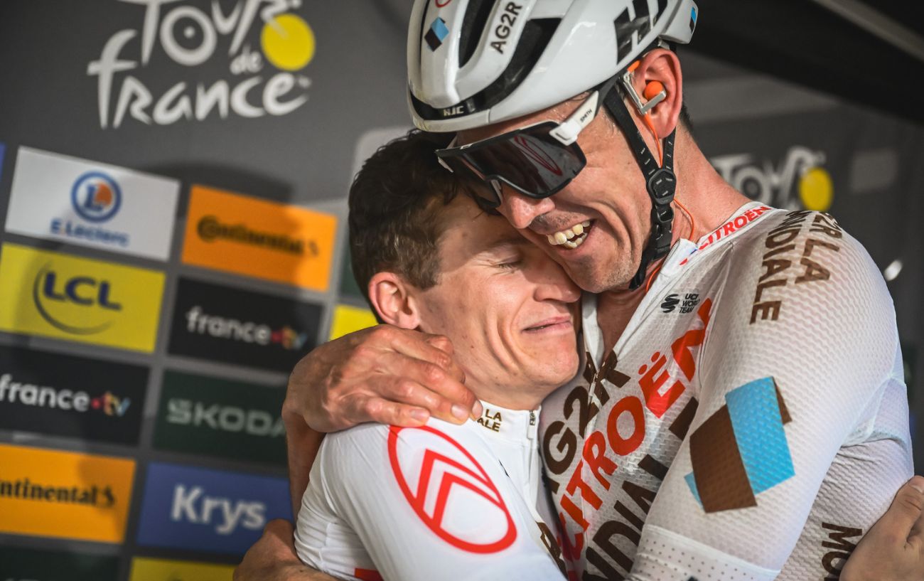 Felix Gall is hugged by a teammate after winning Stage 17 of the 2023 Tour de France.