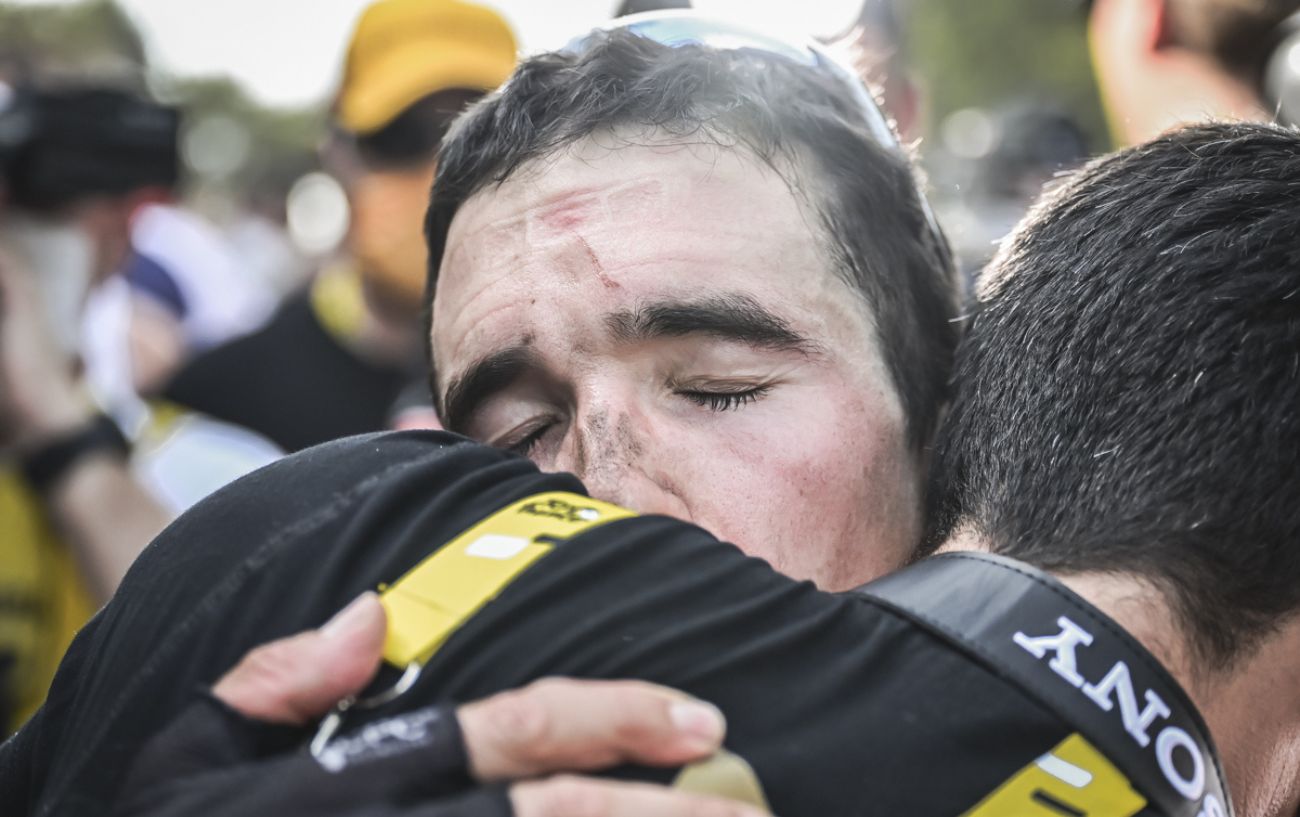 Pello Bilbao embraces a team member following his emotional victory on Stage 10 of the 2023 Tour de France.