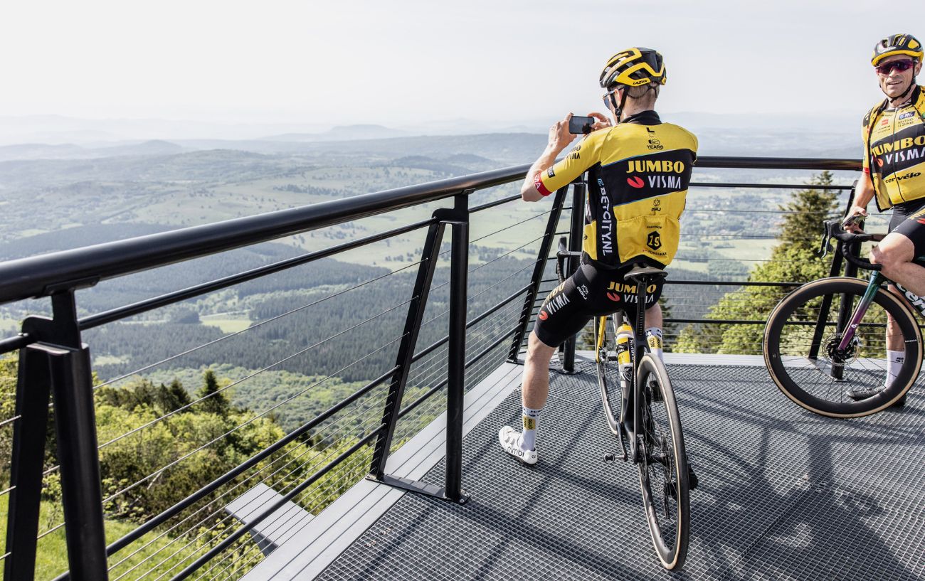 Two Jumbo-Visma riders pause to take in the view on a training ride.