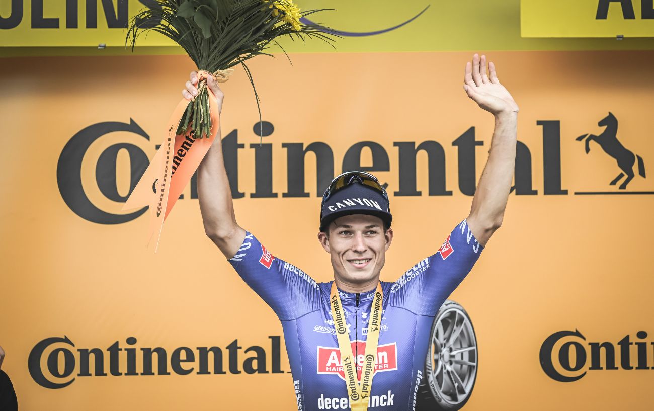 Jasper Philipsen celebrates on the podium after winning Stage 11 of the 2023 Tour de France.