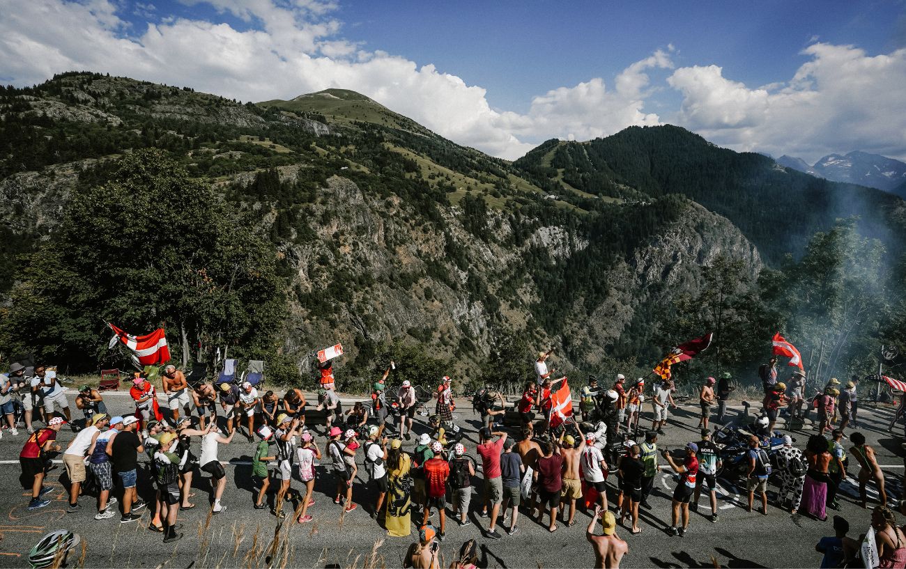 Tour de France fans line the roads in the mountains.