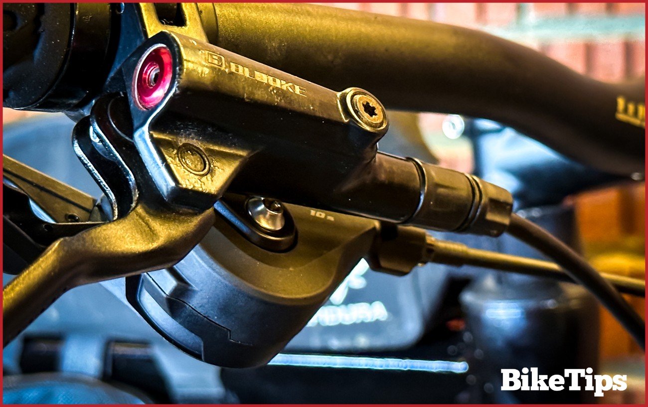 A mountain bike shifter with adjustment dial.