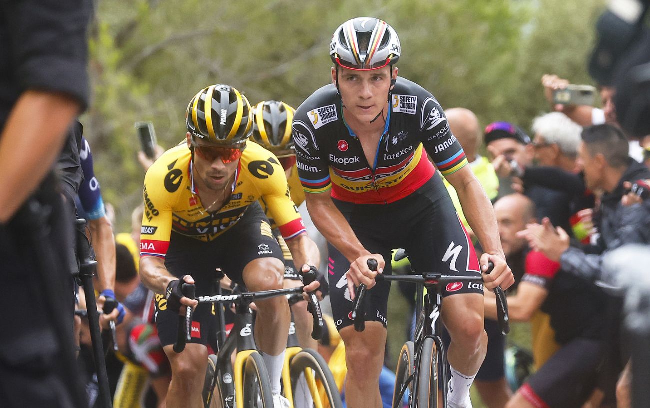 Remco Evenepoel and Primoz Roglic, who could be brought into the same team by a Jumbo-Visma Soudal-QuickStep merger, ascend a climb at the 2023 Vuelta a Espana.