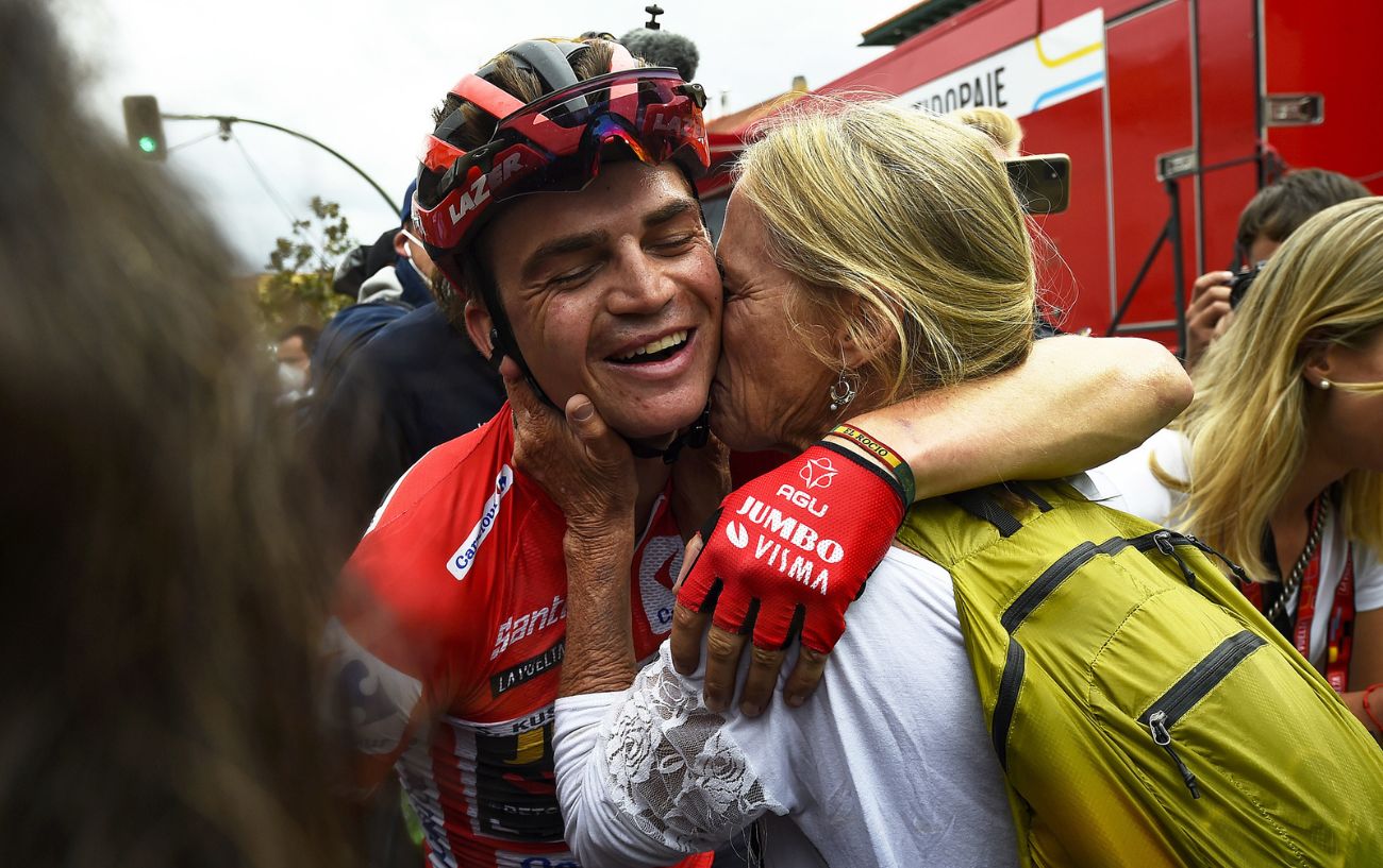 Sepp Kuss shares an embrace after winning the 2023 Vuelta a Espana.