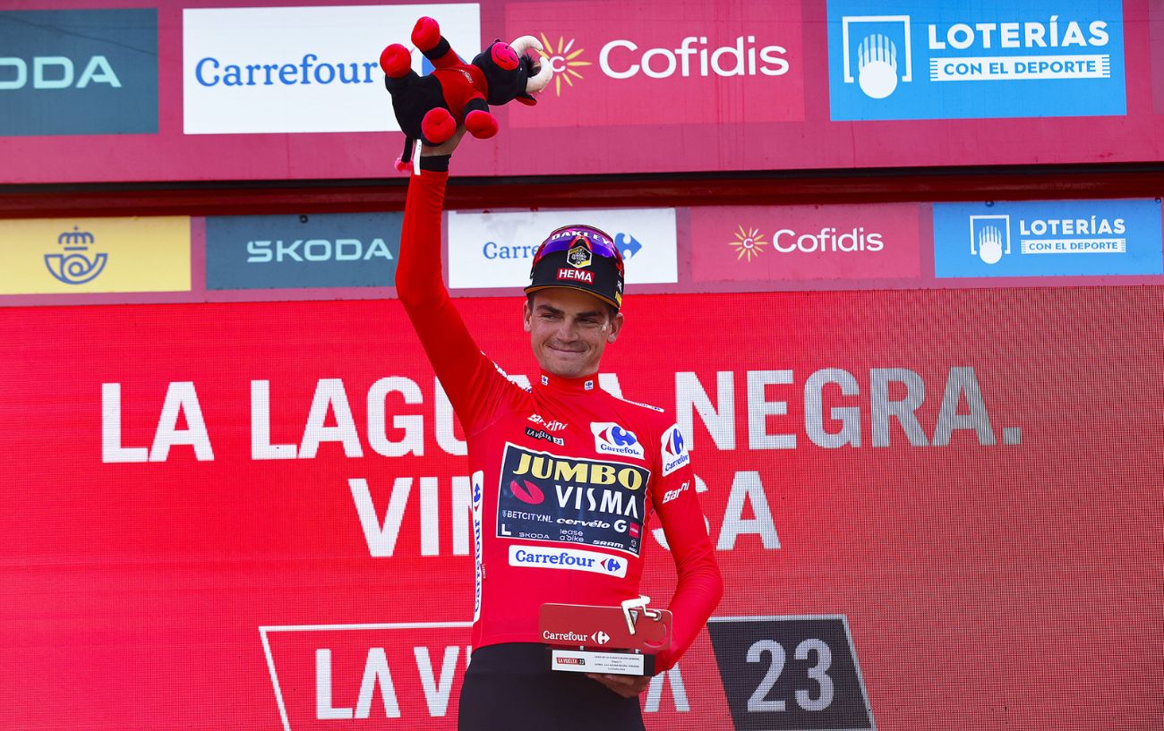 Sepp Kuss is presented with the red jersey at the end of Stage 11 of the 2023 Vuelta a Espana.