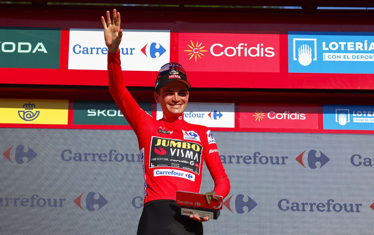 Sepp Kuss is presented with the red jersey after Stage 15 of the 2023 Vuelta a Espana.