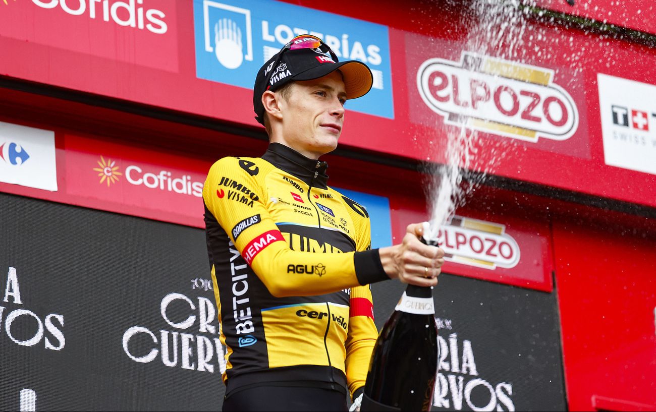 Jonas Vingegaard pops a bottle of champagne after winning Stage 16 of the 2023 Vuelta a Espana.