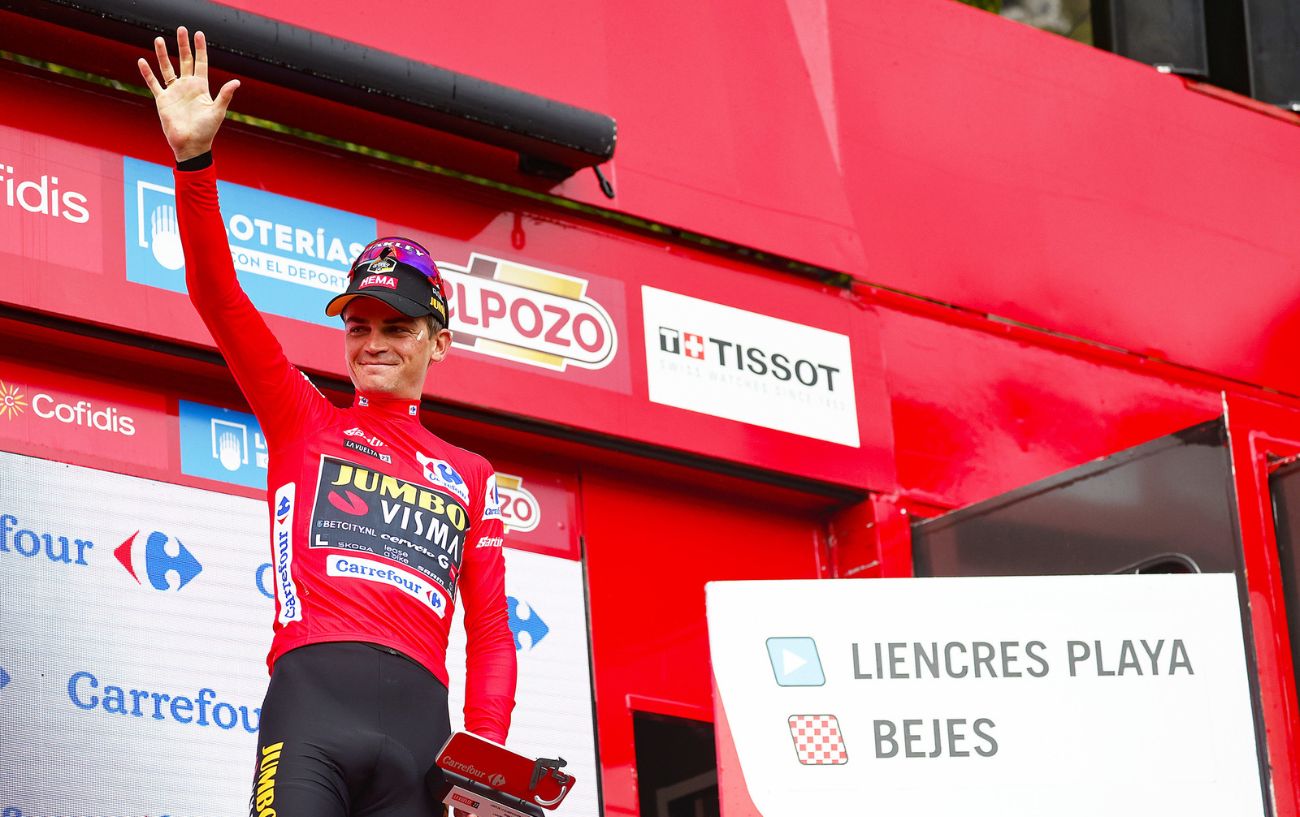 Sepp Kuss is presented with the red jersey after Stage 16 of the 2023 Vuelta a Espana.