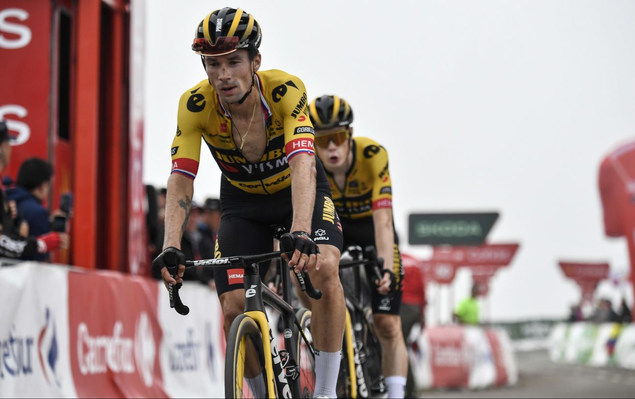Primoz Roglic and Jonas Vingegaard cross the finish line after climbing the Altu de L'Angliru on Stage 17 of the 2023 Vuelta a Espana.